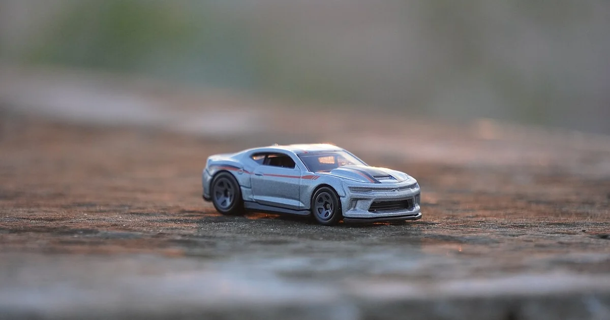 This is a 1:64 size diecast Chevrolet Copo Camaro which is Made by HOTWHEELS.