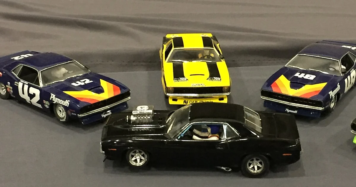 Four Dodge Chargers, two blue, one black and one yellow from the Diecast Convention, Mexico 2017