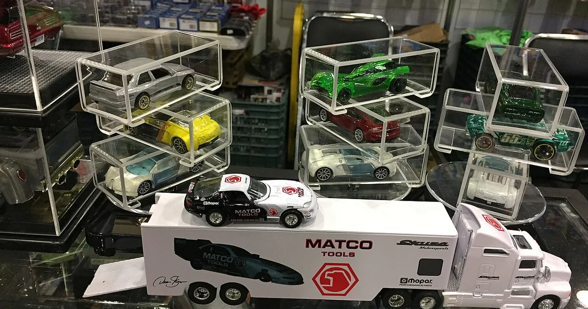 Heavy-duty truck with a trailer for carrying cars with cased cars behind from the Diecast Convention, Mexico 2017